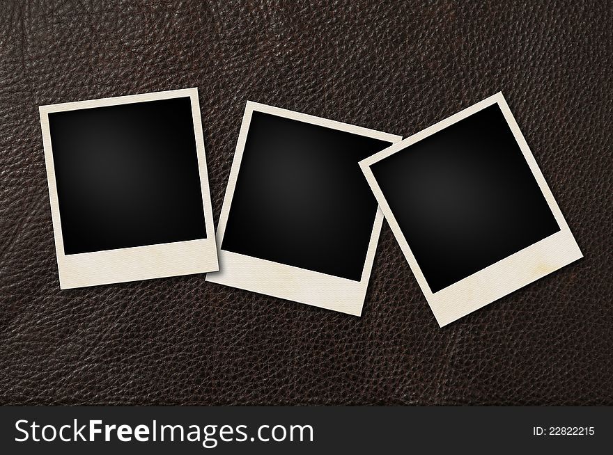 Instant films on brown leather background. Instant films on brown leather background