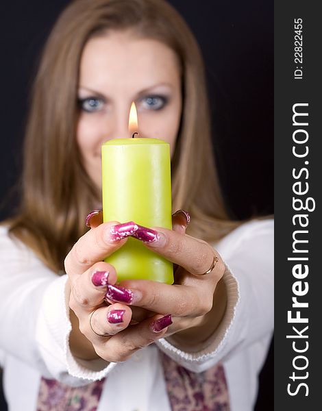 Fashion Girl holds a candle