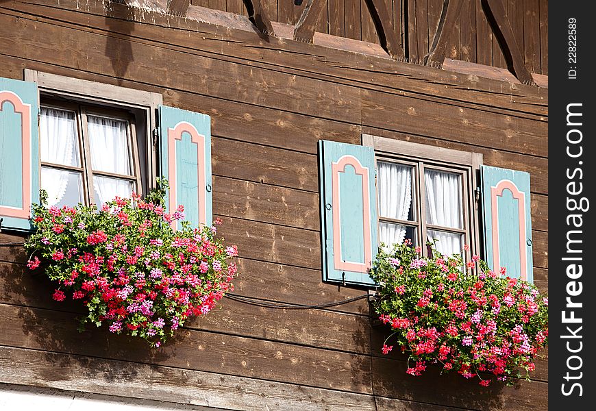 Old house with flowers on the window