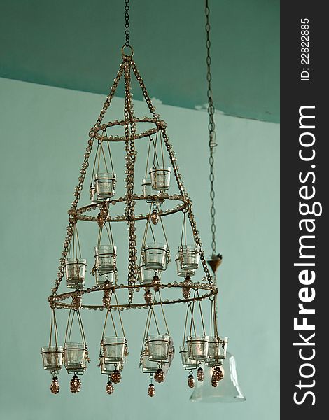 Candles Chandelier in vintage retro style hanged in a mansion house. Candles Chandelier in vintage retro style hanged in a mansion house