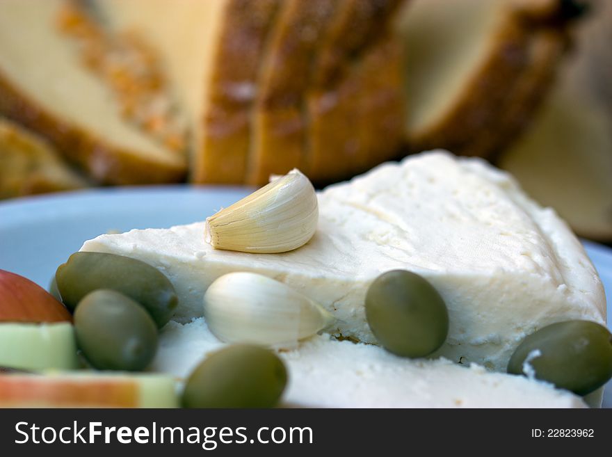 Goat cheese, garlic, olives and corn bread. Goat cheese, garlic, olives and corn bread