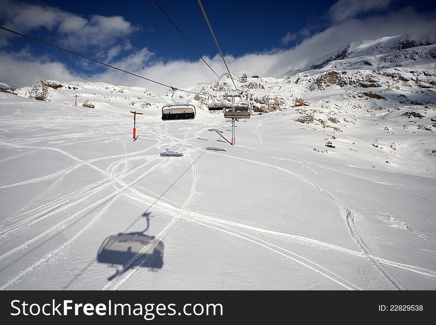 Winter ski lift, chairlift in high Alps. Winter ski lift, chairlift in high Alps