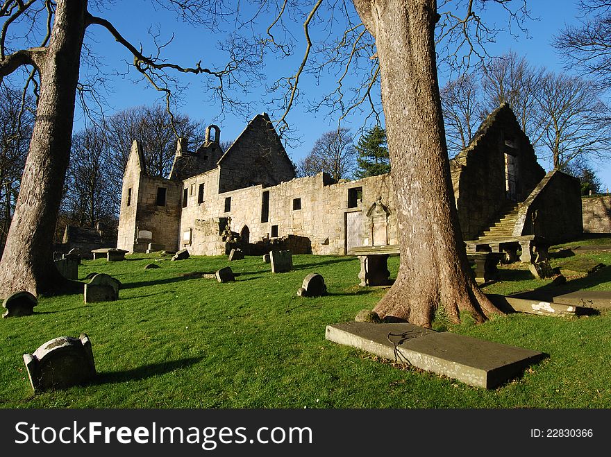 A view across an ancient graveyard to the ruins of St. Bridgets Kirk in Dalgety Bay. A view across an ancient graveyard to the ruins of St. Bridgets Kirk in Dalgety Bay