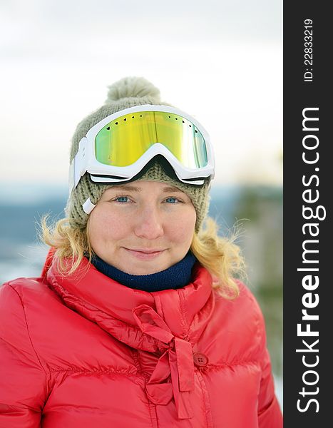 Portrait of girl with blue eyes in goggles