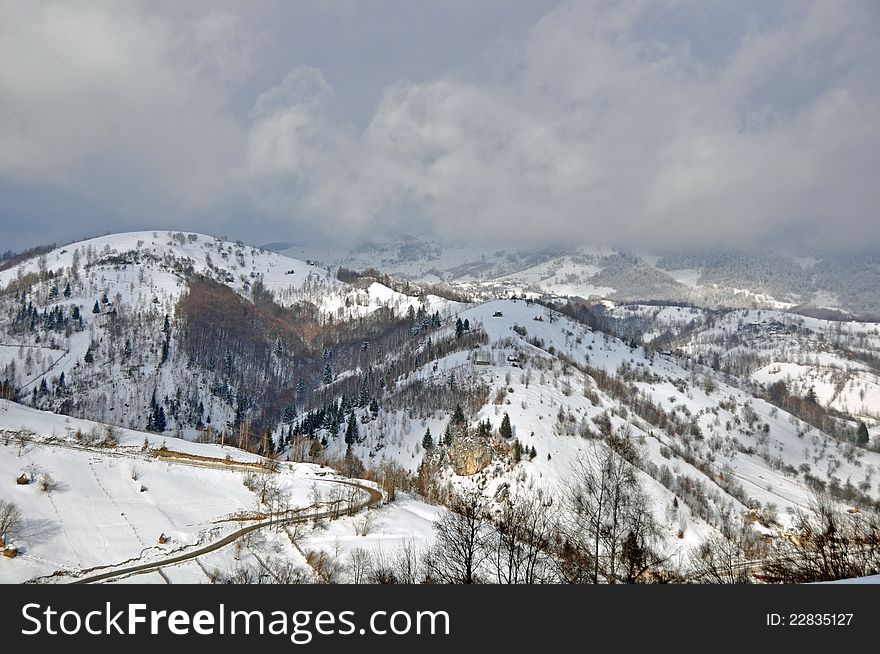 Village view through high mountain on Rucar-Bran pass in middle Romania. Village view through high mountain on Rucar-Bran pass in middle Romania