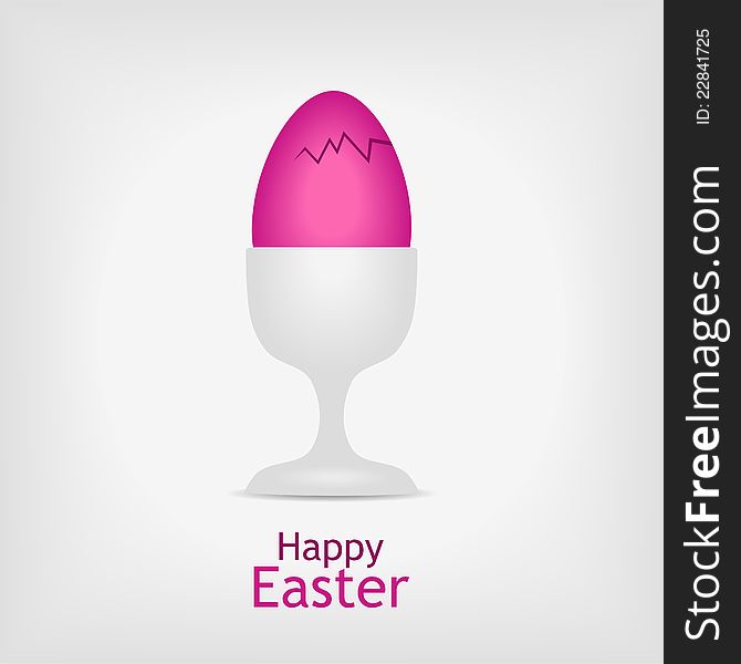 Pink easter egg in white cup on gray background