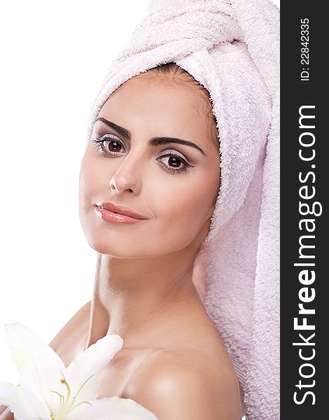 Brunette spa woman in towel on head