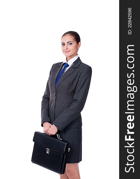 Young businesswoman standing with briefcase and smiling. Young businesswoman standing with briefcase and smiling