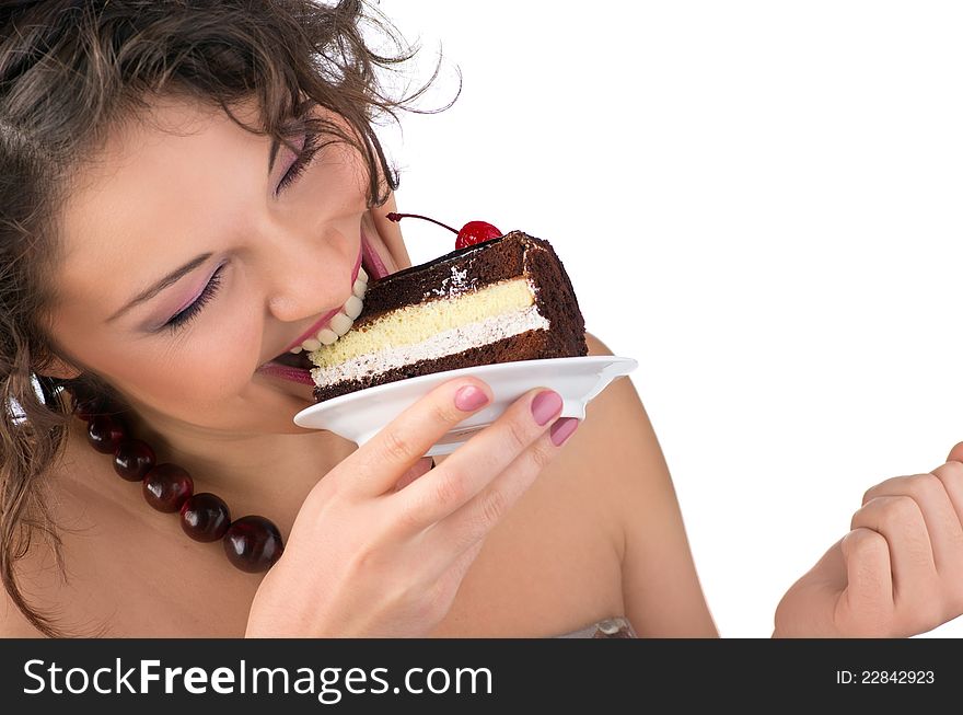 Attractive brunette woman with a cake. Close-up portrait.