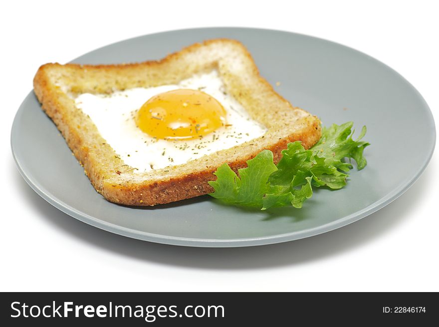 Fried eggs in French with crackling bread and spices