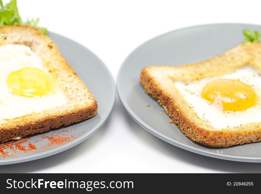 Fried eggs in French with crackling bread and spices