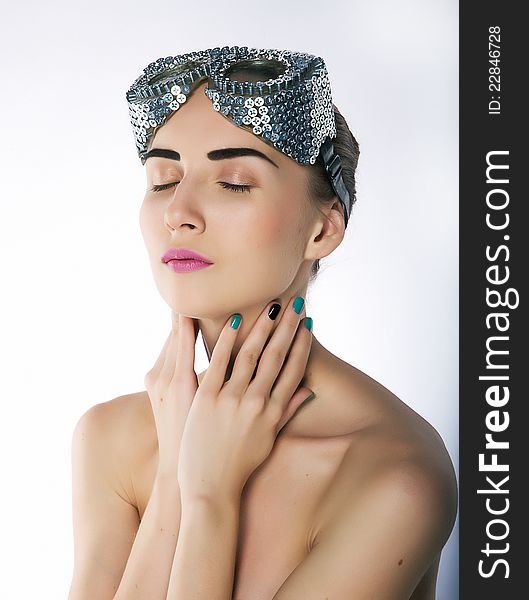 Pretty girl with closed eyes and unusual metallic swim spectacles (protective mask) - series of photos. Pretty girl with closed eyes and unusual metallic swim spectacles (protective mask) - series of photos