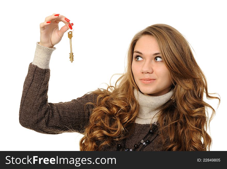 Portrait of charming young woman holding keys isolated over white background. Portrait of charming young woman holding keys isolated over white background