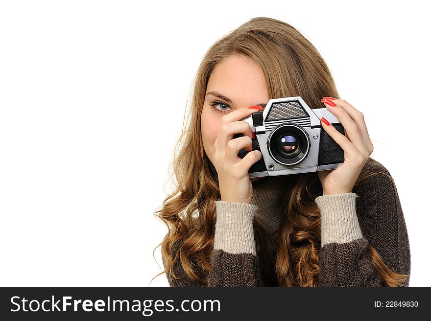 Pretty woman  with vintage camera on a white background