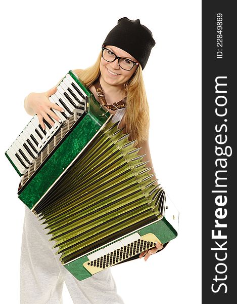 Portrait of the girl, playing an accordion in a cap and glasses. Portrait of the girl, playing an accordion in a cap and glasses