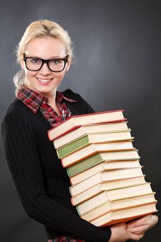 Inteligent Woman In Glasses With Books Royalty Free Stock Photos