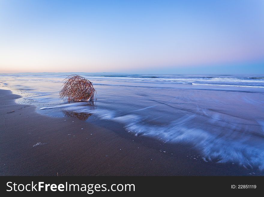 Long exposure to sea and white foam