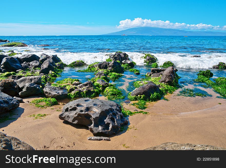 Rocks and sand along the Bay on the island of Maui, Hawaii. Rocks and sand along the Bay on the island of Maui, Hawaii.