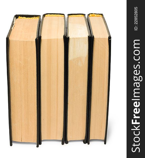 Stack of old black books on white background