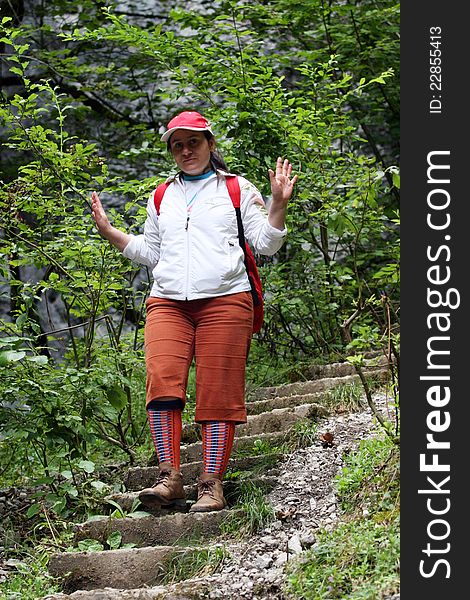 A tourist through the woods down stairs. A tourist through the woods down stairs