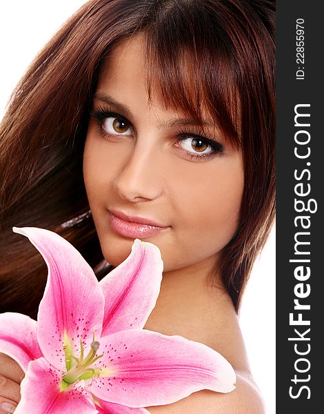 Portrait of young and beautiful woman with lily flower over white background