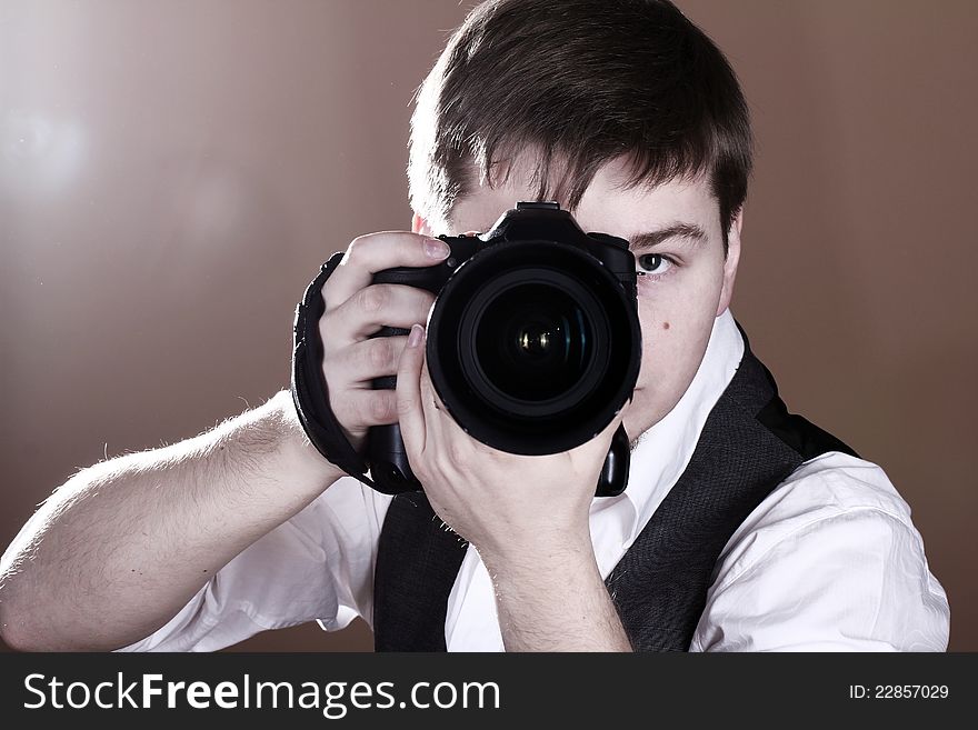 Photographer with camera in studio