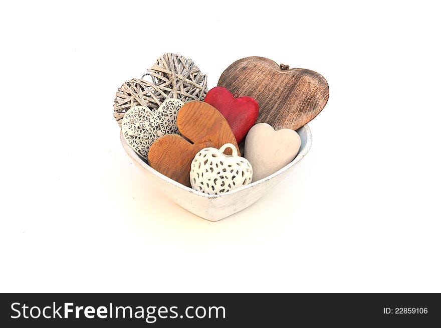 A selection of hearts in a bowl on white. A selection of hearts in a bowl on white
