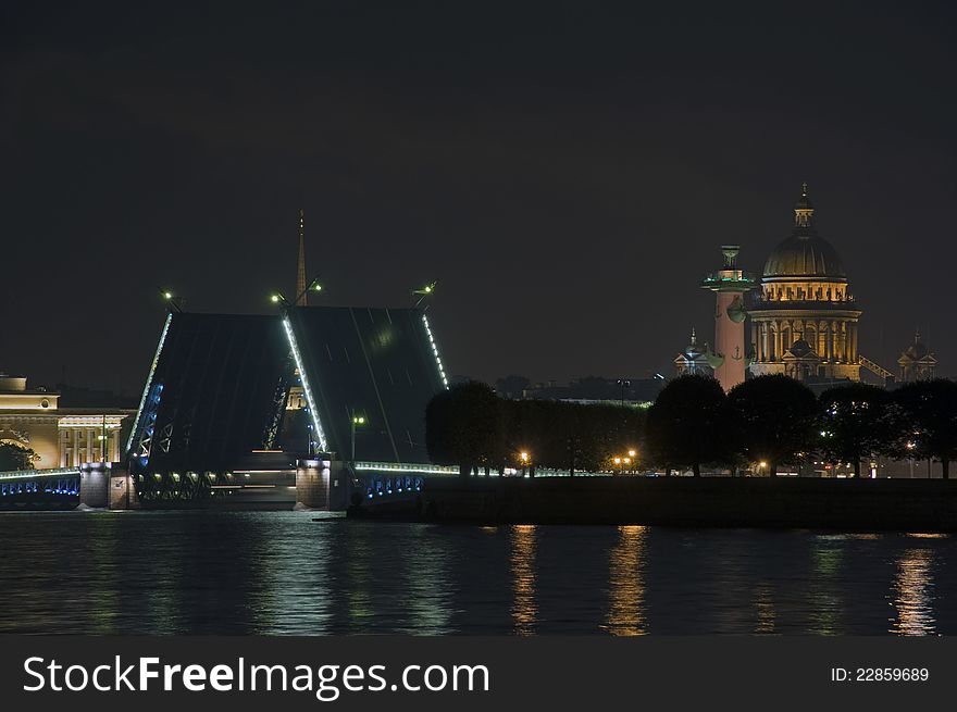 The raised palace bridge in St.-Petersburg at night