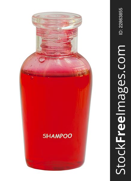 Small red bottle of shampoo isolated on white background