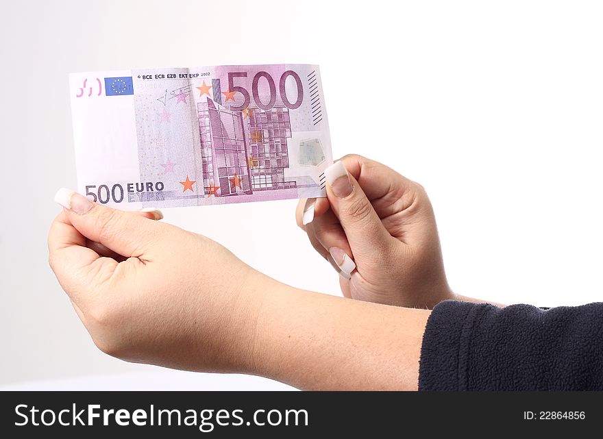 500 euro in the hand of a woman, white background