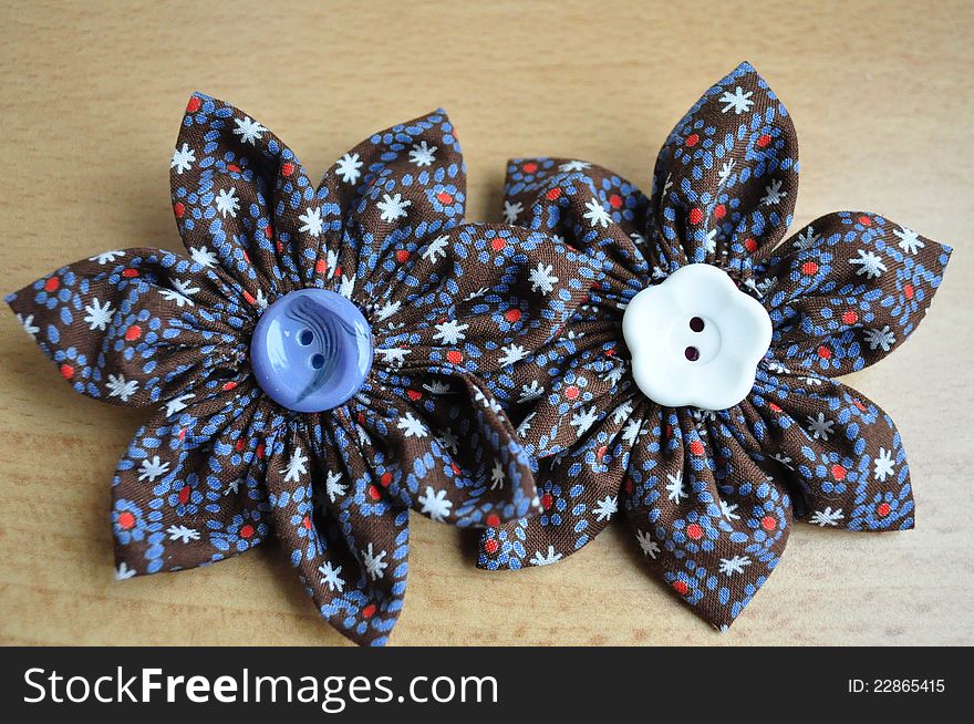 Colorful hand made brooches with buttons in the midlle. Colorful hand made brooches with buttons in the midlle.