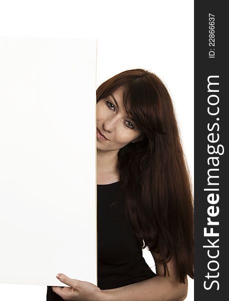 Smiling young woman with a blank board isolates on white background