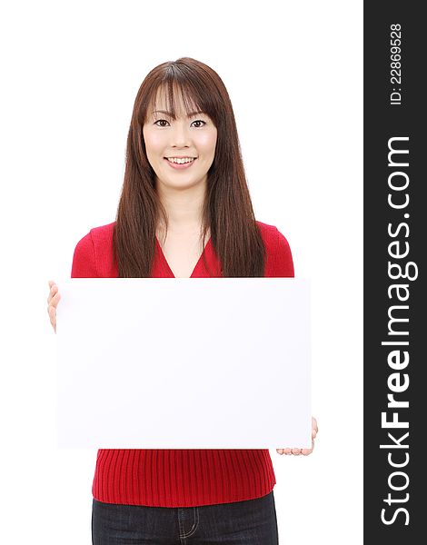 Young asian woman holding blank board in front