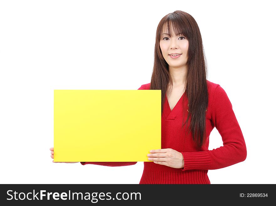 Young asian woman holding blank board