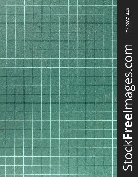 White grid on green cutting mat background