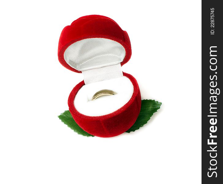 Red box for jeweller ornaments and a gold ring