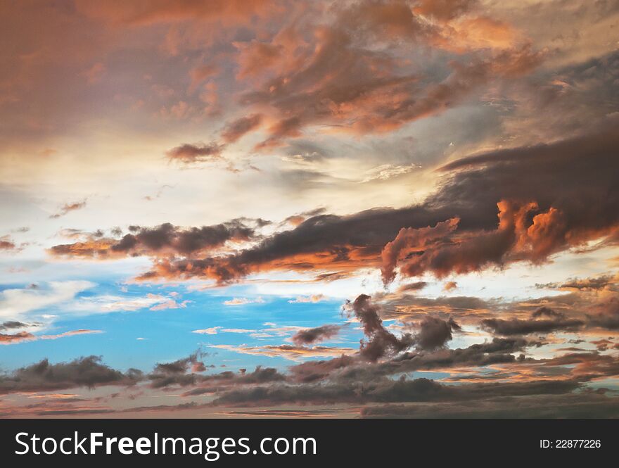 Different hues of clouds during sunset. Different hues of clouds during sunset.