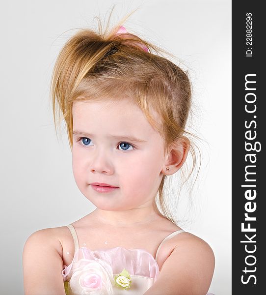 Portrait of the capricious cute little girl