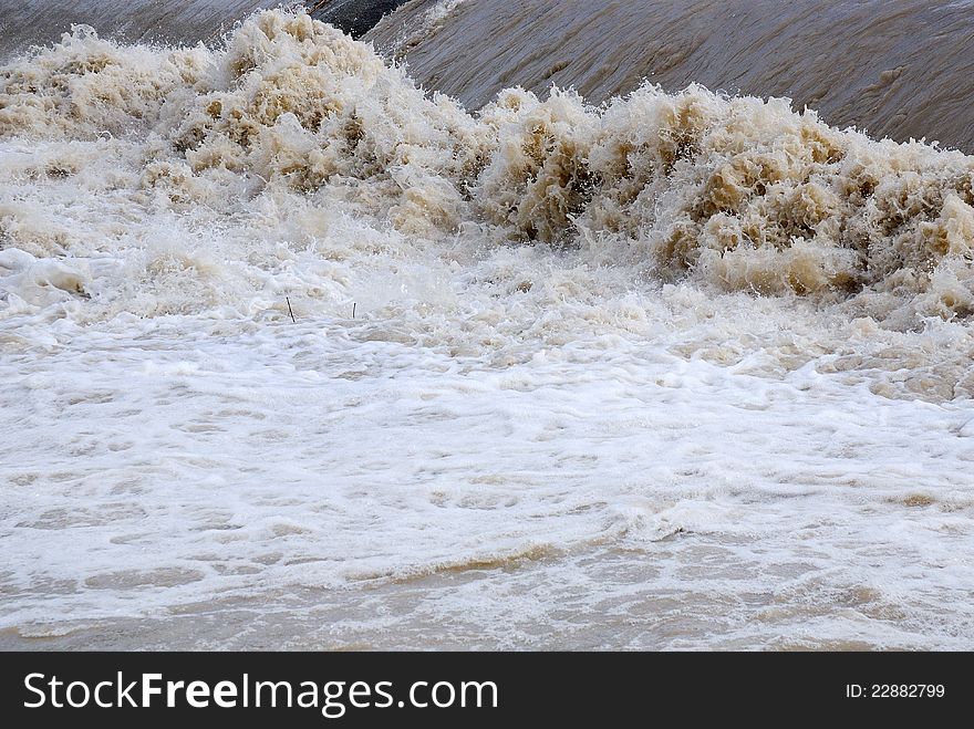 Dangerous rapids with brown water