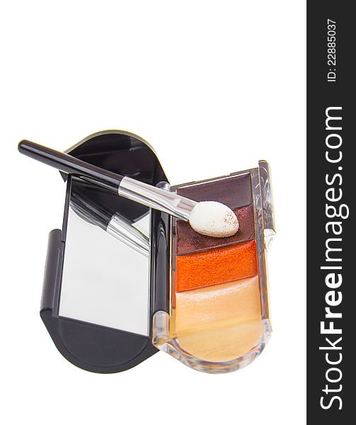 Make-up brush with colorful crushed eyeshadows. Make-up brush with colorful crushed eyeshadows