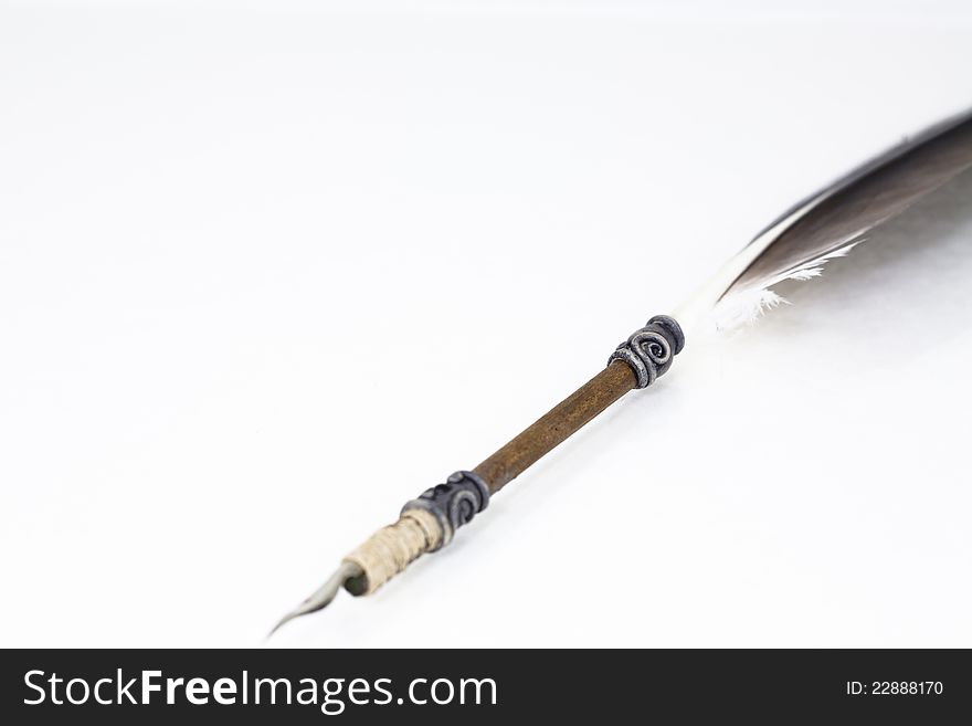 Old handmade feather quill with. Old handmade feather quill with
