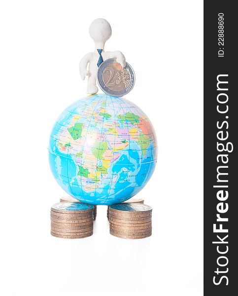 Plasticine man standing on a globe with a coin. Plasticine man standing on a globe with a coin