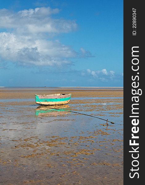 Tropical beach with old fishing boat and ocean. Tropical beach with old fishing boat and ocean