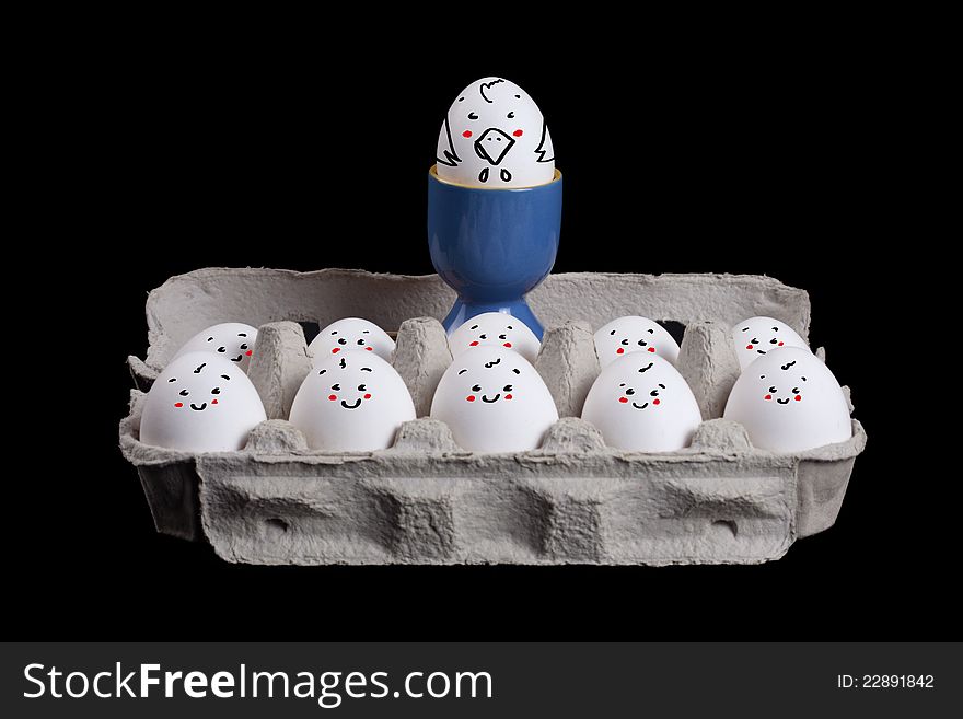 Eggs with smiley faces in eggshell with a boss