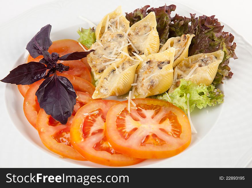 Pasta baked with cheese and tomato slices. Pasta baked with cheese and tomato slices