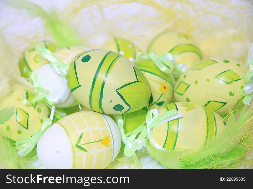 Easter eggs with green feathers. Easter eggs with green feathers