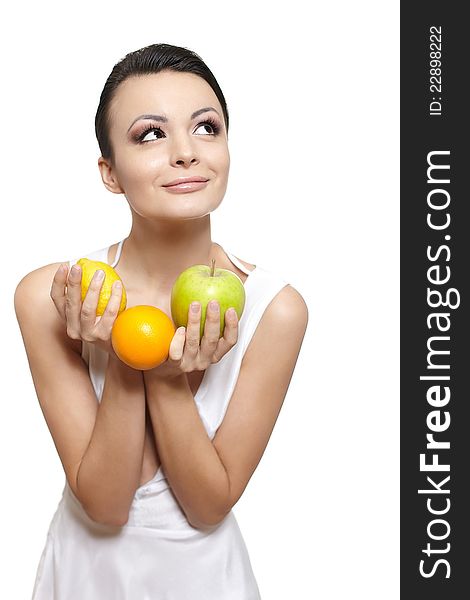 Portrait of beautiful happy smiling girl with  fruits lemon and green apple and orange isolated on white. Portrait of beautiful happy smiling girl with  fruits lemon and green apple and orange isolated on white