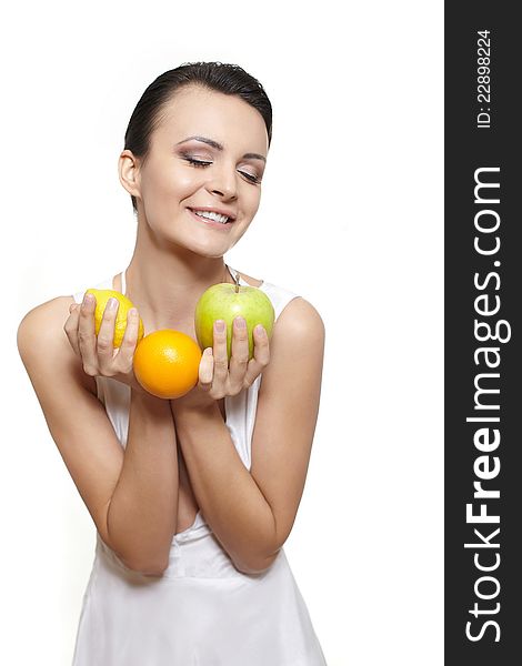 Portrait of beautiful happy smiling girl with fruits lemon and green apple and orange isolated on white. Portrait of beautiful happy smiling girl with fruits lemon and green apple and orange isolated on white