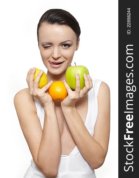 Portrait of beautiful happy smiling girl with fruits lemon and green apple and orange isolated on white. Portrait of beautiful happy smiling girl with fruits lemon and green apple and orange isolated on white