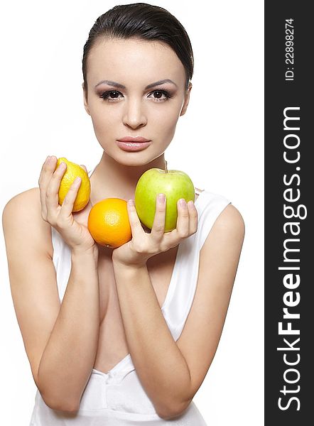 Portrait of beautiful glamour girl with  fruits lemon and green apple and orange isolated on white. Portrait of beautiful glamour girl with  fruits lemon and green apple and orange isolated on white